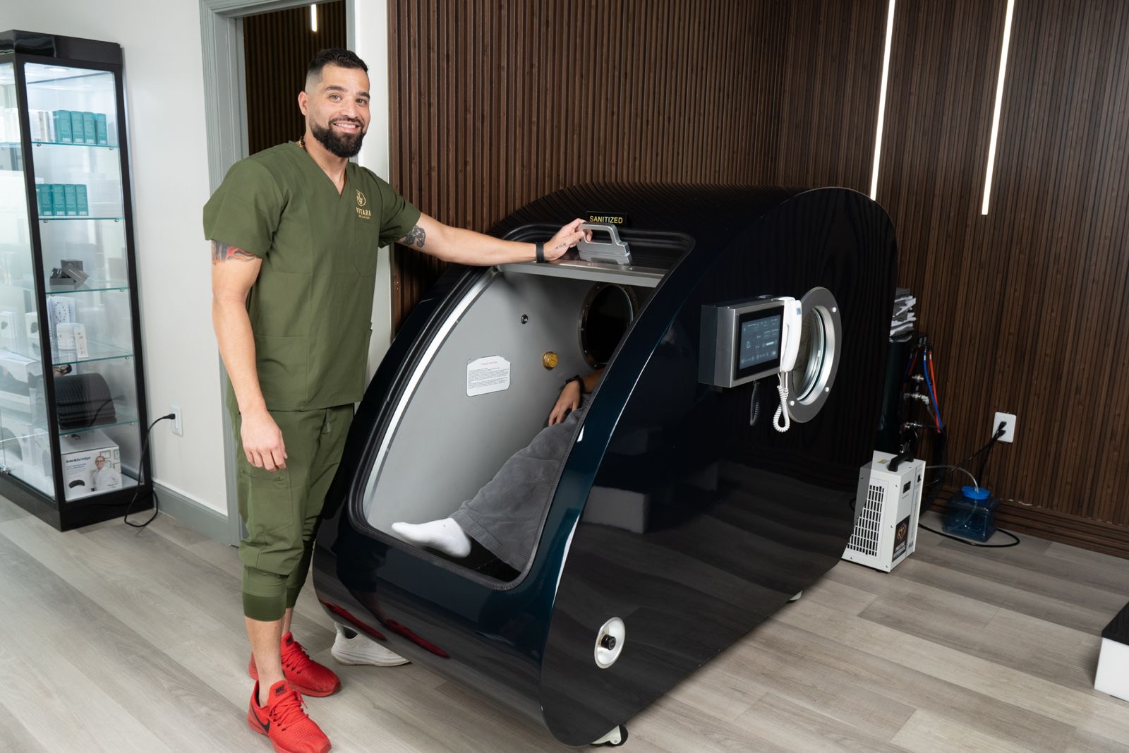 Vytara team member with hyperbaric chamber